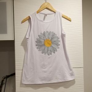 A white tank with a daisy